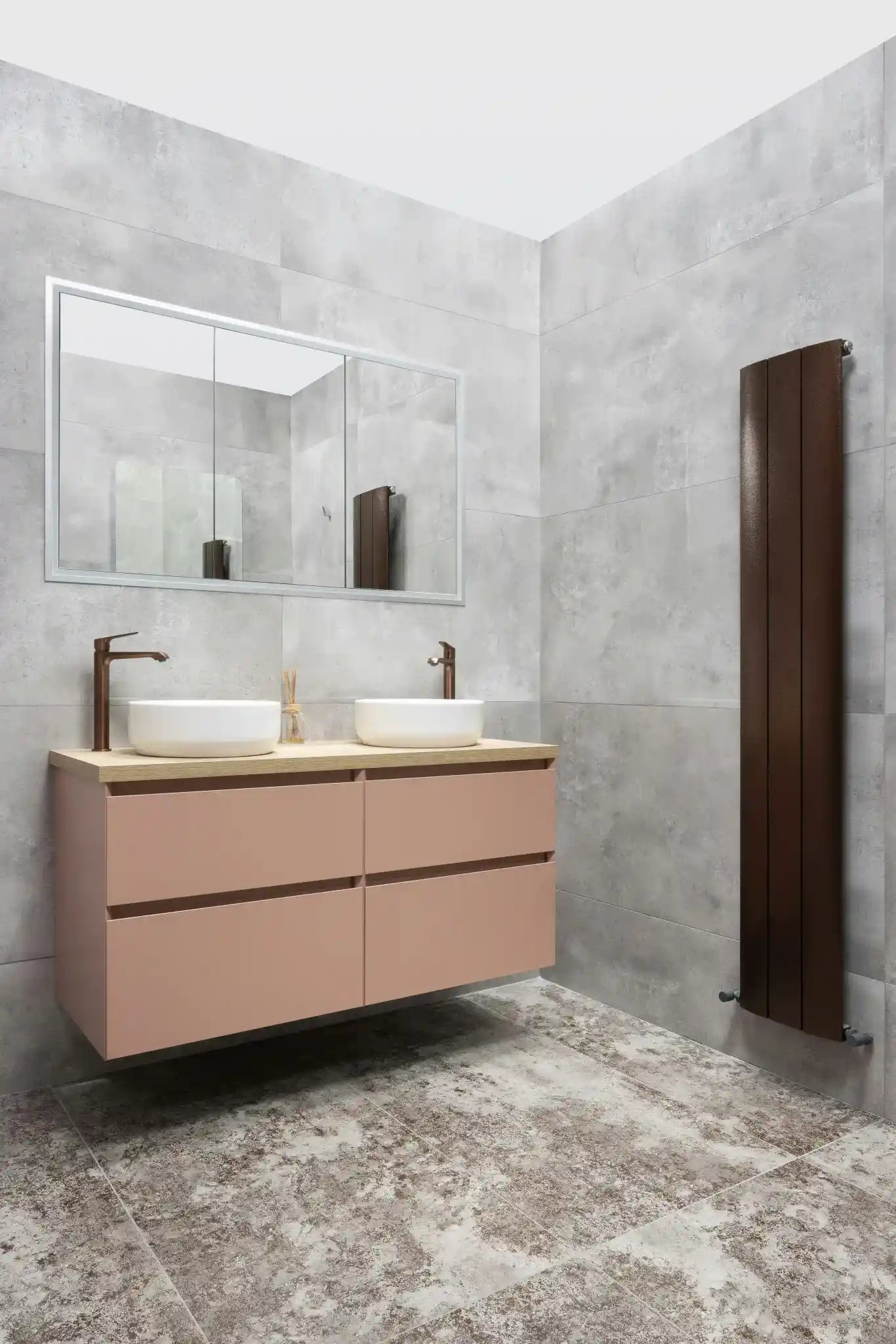 Large-format concrete-look gray tiles on bathroom walls and floor with a pink floating double vanity